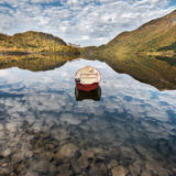 Red boat on clouds Ryggedalsvatnet